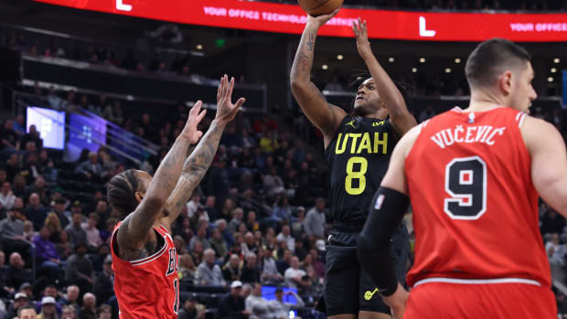 Mar 6, 2024; Salt Lake City, Utah, USA; Utah Jazz forward Brice Sensabaugh (8) shoots over Chicago Bulls forward DeMar DeRozan (11) during the first quarter at Delta Center. Mandatory Credit: Rob Gray-USA TODAY Sports